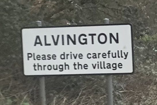 Alvington village sign on the A48 – electricians covering Alvington
